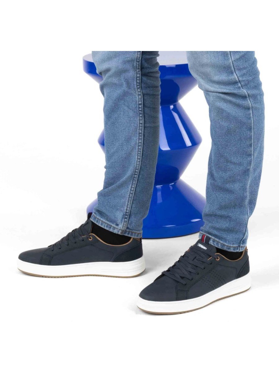 Navy perforated sneakers with tan collar