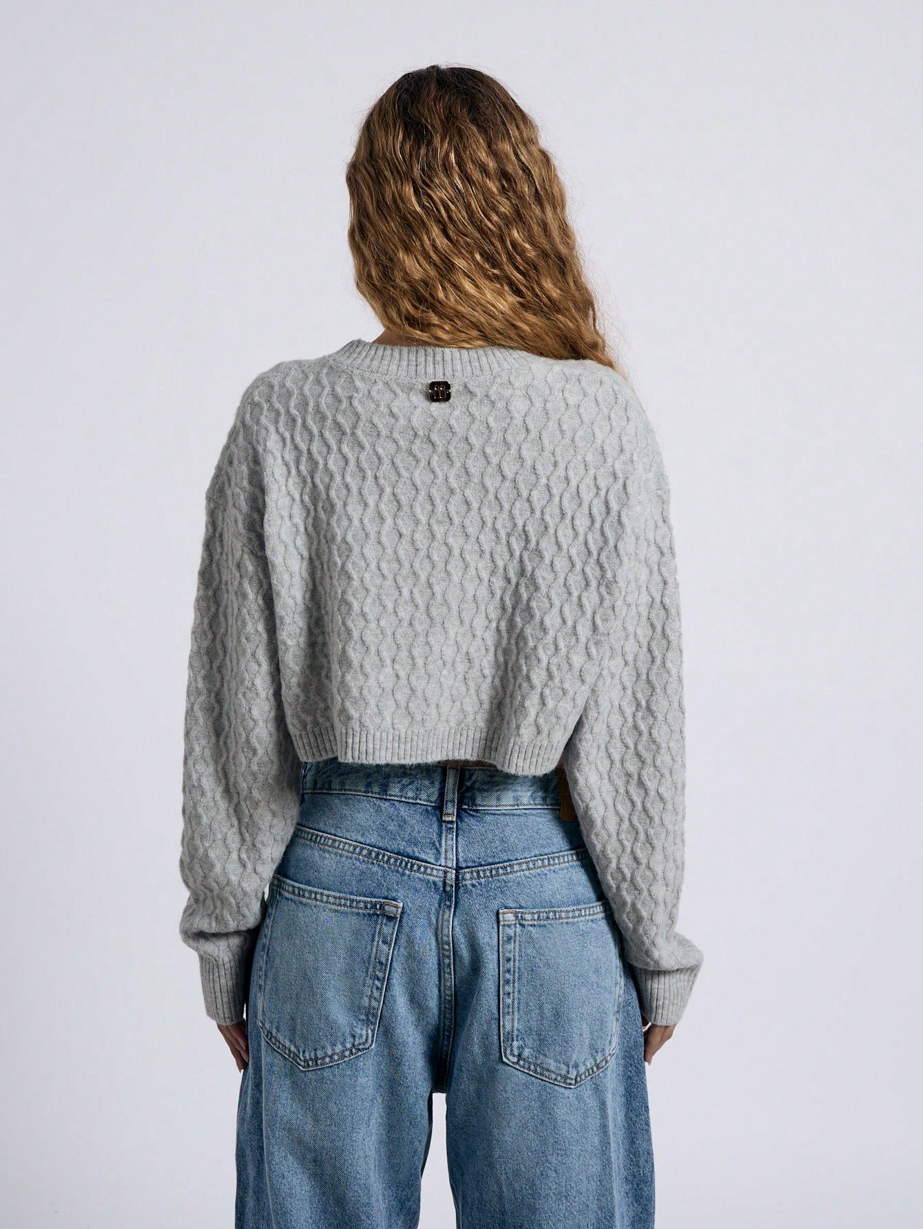 Cardigan court en tricot de câble