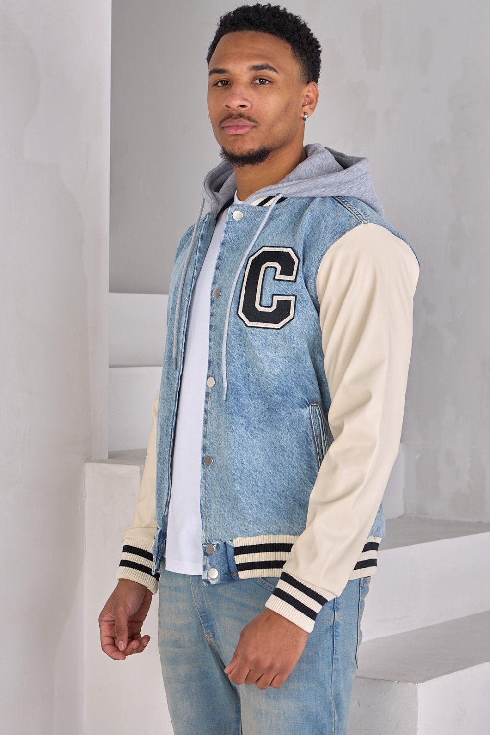 Blue denim jacket with faux leather sleeves