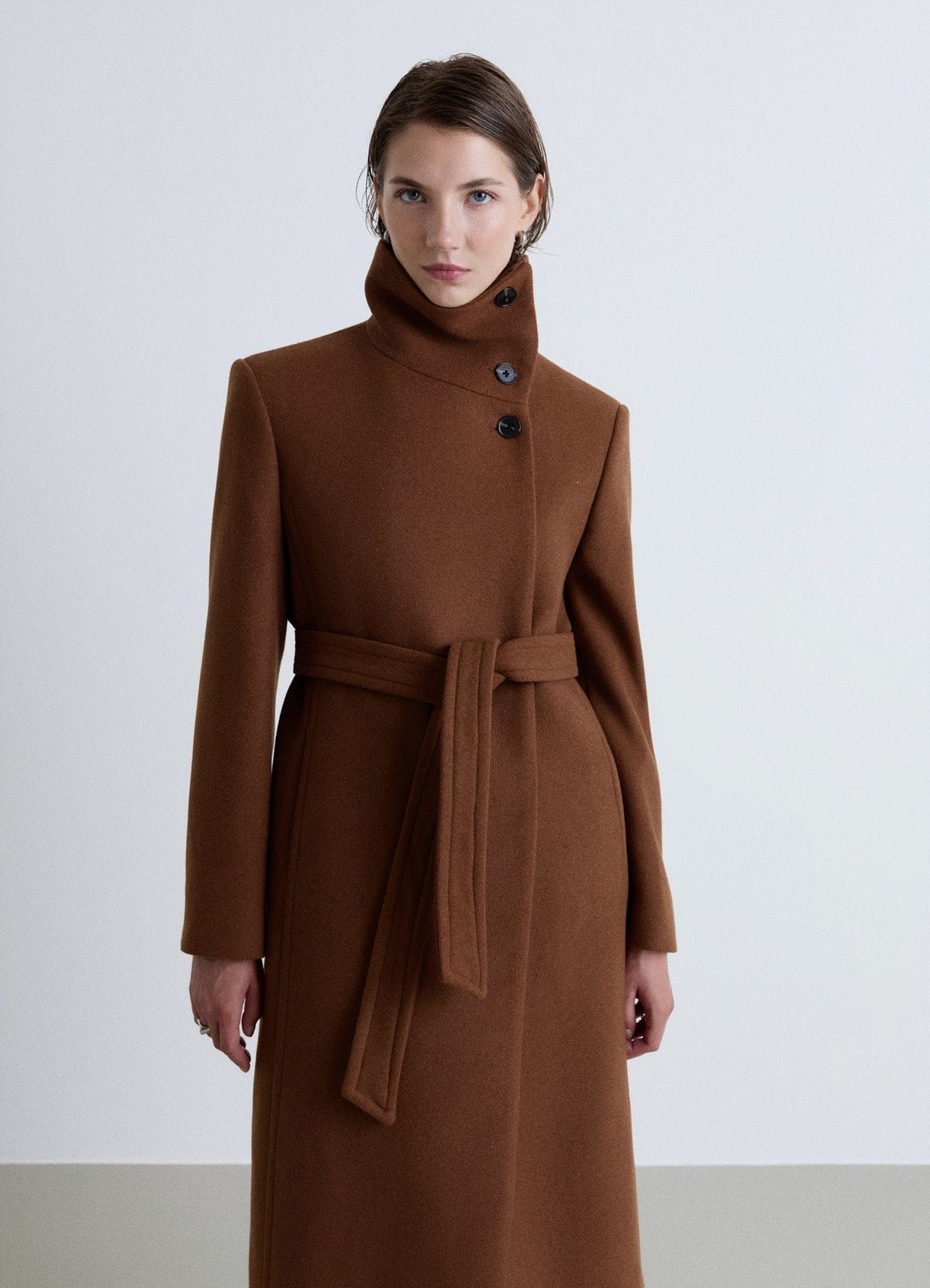 Long high-neck belted coat