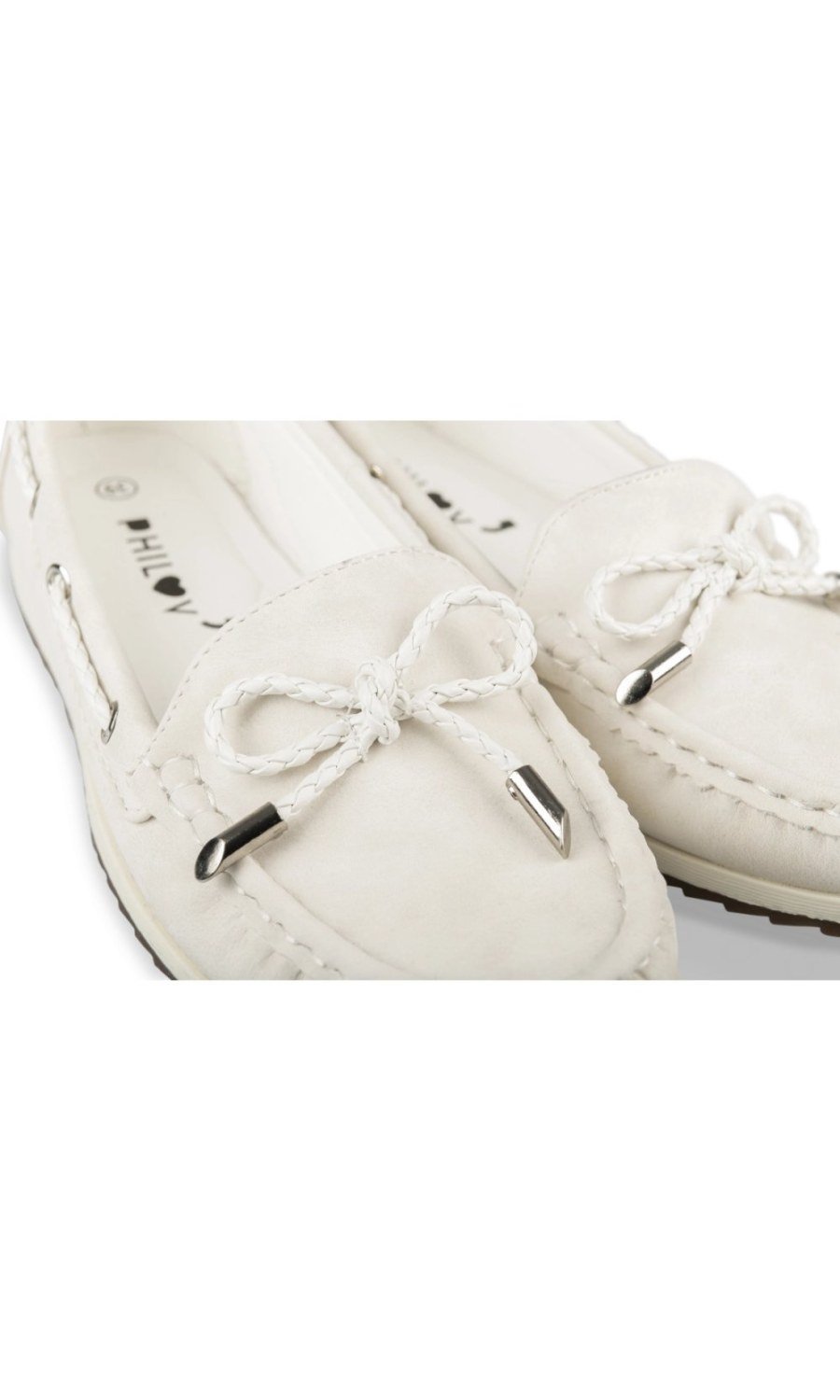 White loafers with bow and eyelets