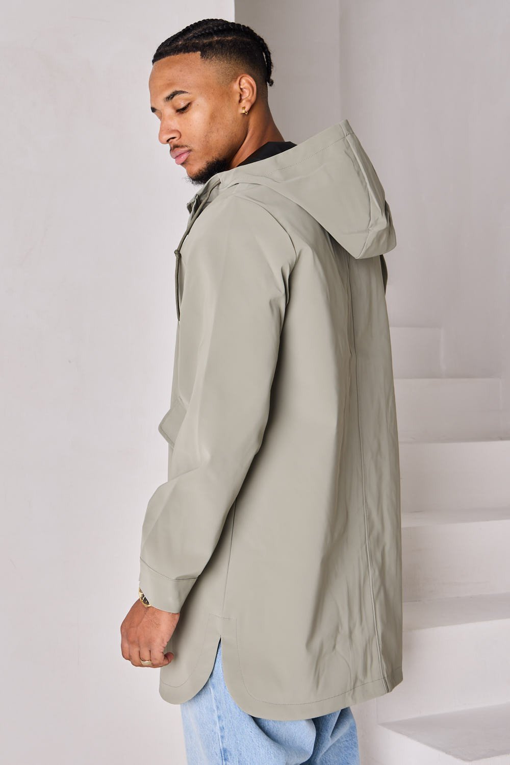 Green textured hooded rain jacket