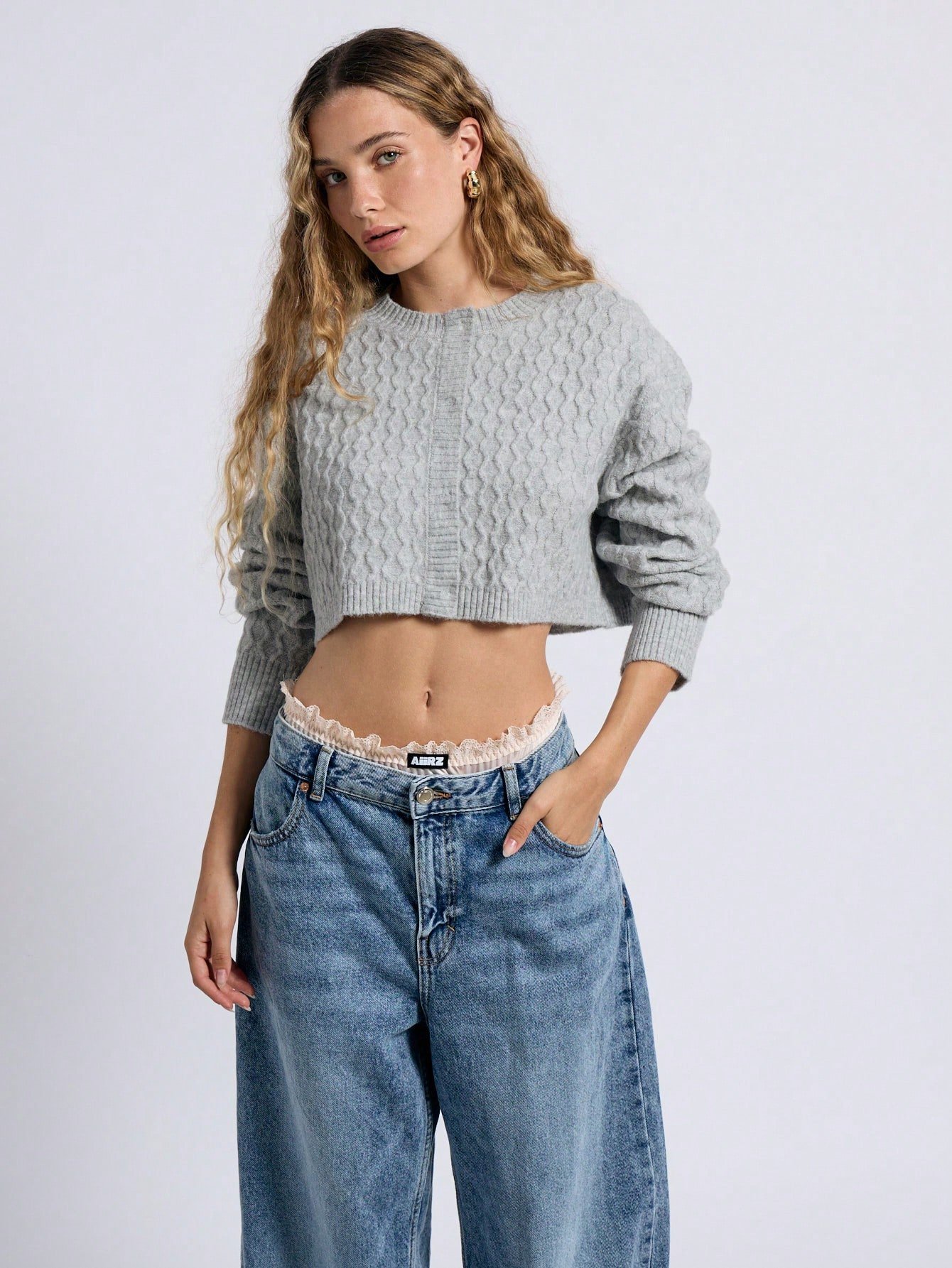 Cardigan court en tricot de câble