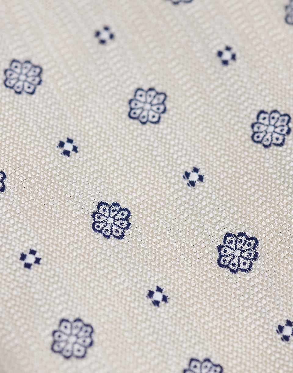 Cravate et pochette à motif géométrique fleuri