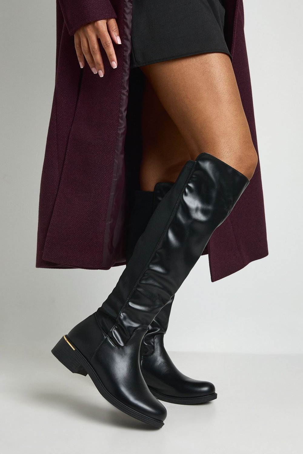 Black chunky knee-high boots