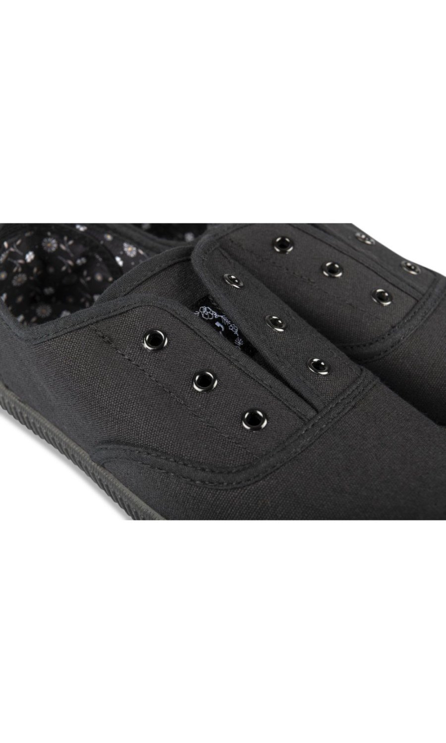 All-black canvas slip-on sneakers