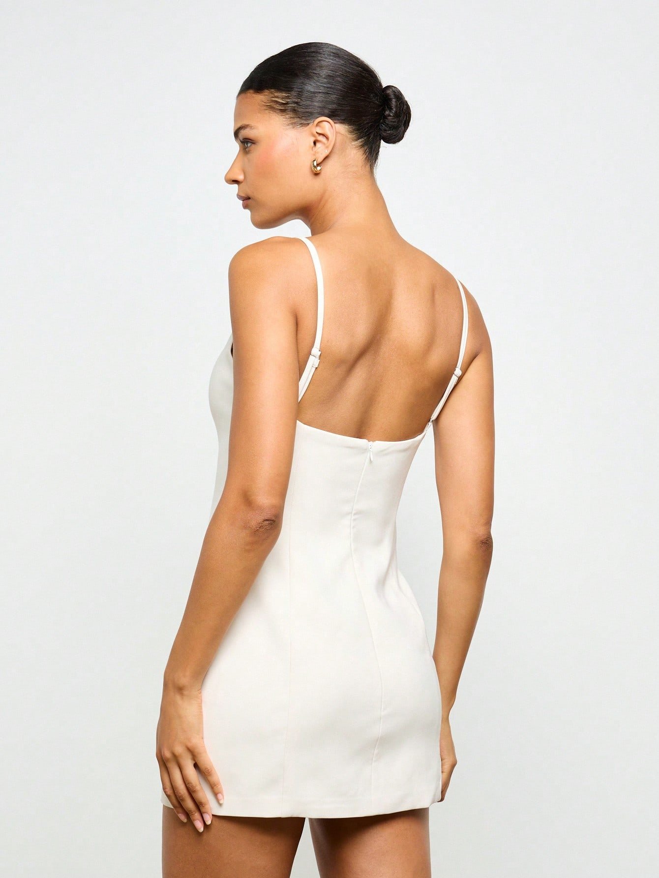 Fitted backless mini dress with high neck