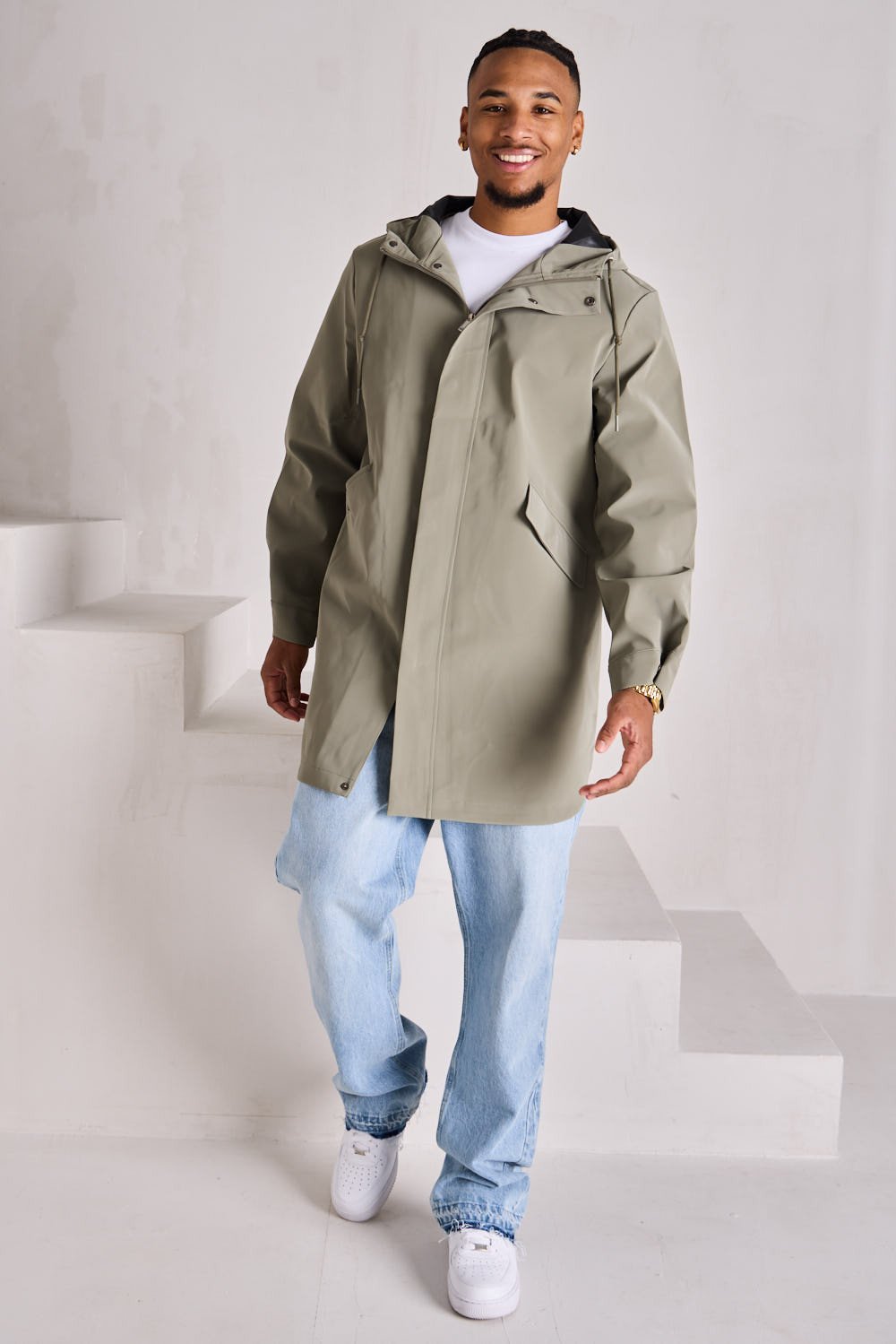 Green textured hooded rain jacket