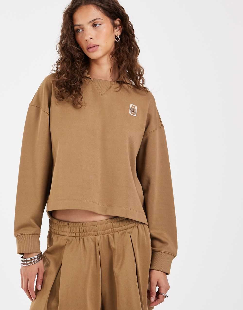 Polo manches longues à logo camel