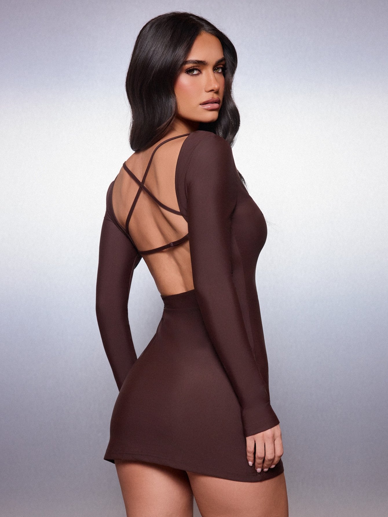 Fitted V-neck mini dress with open cross back