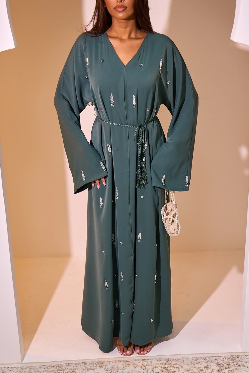 Dark green abaya with ear and floral rhinestones